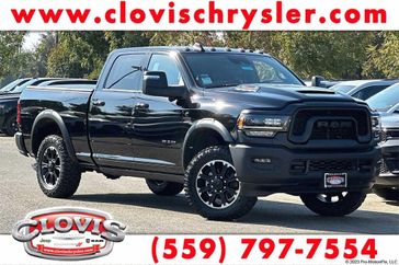 2024 RAM 2500 Rebel Crew Cab 4x4 6'4' Box in a Diamond Black Crystal Pearl Coat exterior color and Blackinterior. Clovis Chrysler Dodge Jeep RAM 559-314-1399 clovischryslerdodgejeepram.com 