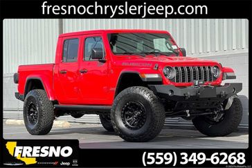 2024 Jeep Gladiator Rubicon X 4x4 in a Firecracker Red Clear Coat exterior color. Fresno Chrysler Dodge Jeep RAM 559-206-5254 fresnochryslerjeep.com 