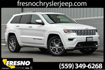 2021 Jeep Grand Cherokee Overland in a Bright White Clear Coat exterior color and Light Frost/Browninterior. Fresno Chrysler Dodge Jeep RAM 559-206-5254 fresnochryslerjeep.com 