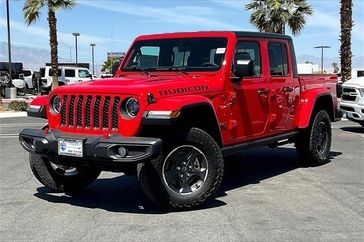 2023 Jeep Gladiator Rubicon 4x4 in a Firecracker Red Clear Coat exterior color and Blackinterior. I-10 Chrysler Dodge Jeep Ram (760) 565-5160 pixelmotiondemo.com 