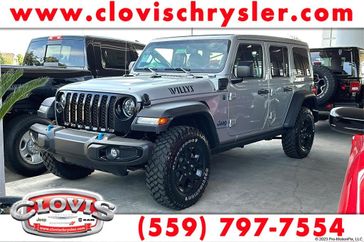 2023 Jeep Wrangler Willys 4xe in a Silver Zynith Clear Coat exterior color and Blackinterior. Clovis Chrysler Dodge Jeep RAM 559-314-1399 clovischryslerdodgejeepram.com 