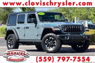 2024 Jeep Wrangler 4-door Rubicon 4xe in a Anvil Clear Coat exterior color. Clovis Chrysler Dodge Jeep RAM 559-314-1399 clovischryslerdodgejeepram.com 