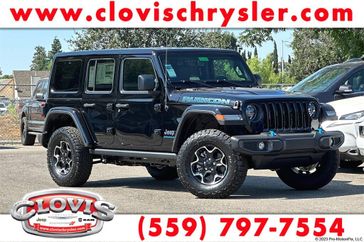 2023 Jeep Wrangler Rubicon 4xe in a Black Clear Coat exterior color and Blackinterior. Clovis Chrysler Dodge Jeep RAM 559-314-1399 clovischryslerdodgejeepram.com 