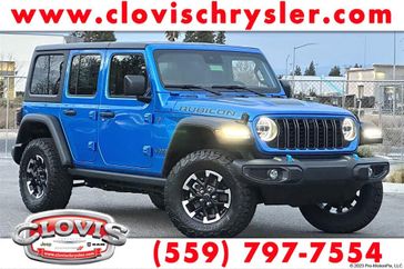 2024 Jeep Wrangler 4-door Rubicon 4xe in a Hydro Blue Pearl Coat exterior color and Blackinterior. Clovis Chrysler Dodge Jeep RAM 559-314-1399 clovischryslerdodgejeepram.com 