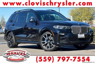 2021 BMW X7 xDrive40i in a Carbon Black Metallic exterior color and Coffeeinterior. Clovis Chrysler Dodge Jeep RAM 559-314-1399 clovischryslerdodgejeepram.com 