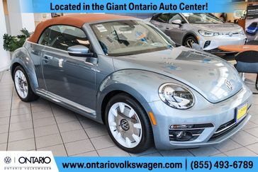 2019 Volkswagen Beetle Convertible 2.0T Final Edition SEL in a Stonewashed Blue Metallic/Brown Roof exterior color and Titan Blackinterior. Ontario Auto Center ontarioautocenter.com 