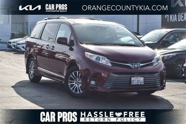 2020 Toyota Sienna XLE in a Salsa Red Pearl exterior color and Ashinterior. BEACH BLVD OF CARS beachblvdofcars.com 