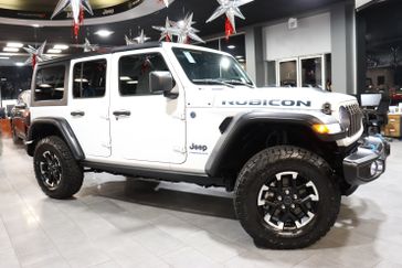 2024 Jeep Wrangler 4-door Rubicon 4xe in a Bright White Clear Coat exterior color and Blackinterior. J Star Chrysler Dodge Jeep Ram of Anaheim Hills 888-802-2956 jstarcdjrofanaheimhills.com 