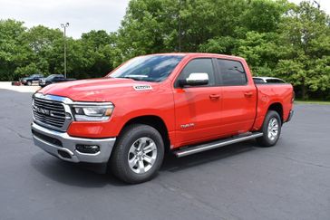 2023 RAM 1500 Laramie Crew Cab 4x4 5'7' Box in a Flame Red Clear Coat exterior color. Tom Whiteside Auto Sales 740-831-2535 whitesidecars.com 
