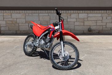 2024 HONDA CRF 125F Big Wheel in a RED exterior color. Family PowerSports (877) 886-1997 familypowersports.com 