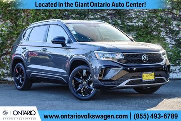 2023 Volkswagen Taos 1.5T SE in a Pure Gray w/Black Roof exterior color and Blackinterior. Ontario Auto Center ontarioautocenter.com 