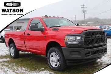 2024 RAM 3500 Tradesman Regular Cab 4x4 8' Box in a Flame Red Clear Coat exterior color and Blackinterior. Watson Benzie, LLC 231-383-7836 watsonchryslerdodgejeep.com 