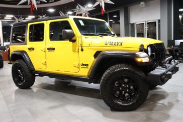 2020 Jeep Wrangler Unlimited Willys in a Baja Yellow Clear Coat exterior color and Blackinterior. J Star Chrysler Dodge Jeep Ram of Anaheim Hills 888-802-2956 jstarcdjrofanaheimhills.com 