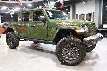 2023 Jeep Gladiator Mojave 4x4 in a Sarge Green Clear Coat exterior color and Blackinterior. J Star Chrysler Dodge Jeep Ram of Anaheim Hills 888-802-2956 jstarcdjrofanaheimhills.com 