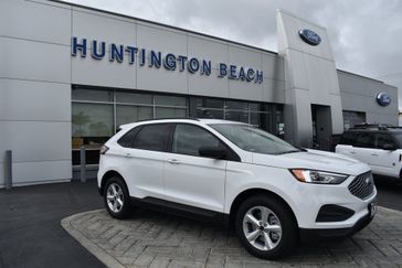 2024 Ford Edge SE in a Oxford White exterior color and Ebonyinterior. BEACH BLVD OF CARS beachblvdofcars.com 