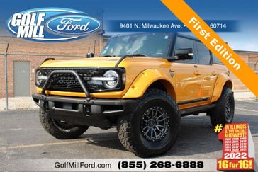 2021 Ford Bronco First Edition in a Cyber Orange Metallic Tri Coat exterior color and Roastinterior. Glenview Luxury Imports 847-904-1233 glenviewluxuryimports.com 