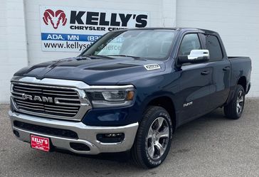 2024 RAM 1500 Laramie Crew Cab 4x4 5'7' Box in a Patriot Blue Pearl Coat exterior color. Kelly’s Chrysler Center 888-806-1140 pixelmotiondemo.com 