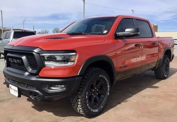 2023 RAM 1500 Rebel Crew Cab 4x4 5'7' Box in a Flame Red Clear Coat exterior color and Blackinterior. Matthews Chrysler Dodge Jeep Ram 918-276-8729 cyclespecialties.com 