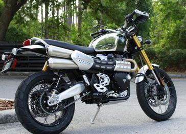 2023 Triumph Scrambler 1200 XE in a CHROME/BROOKLANDS GREEN exterior color. Euro Cycles of Orlando 407-826-4269 eurocyclesoforlando.com 