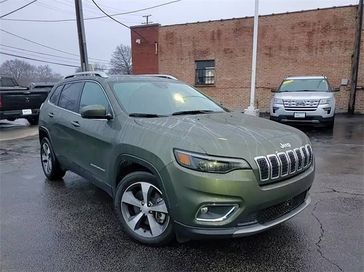 2021 Jeep Cherokee Limited in a Olive Green Pearl Coat exterior color and Blackinterior. Glenview Luxury Imports 847-904-1233 glenviewluxuryimports.com 