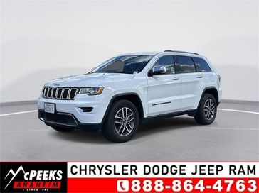 2021 Jeep Grand Cherokee Limited in a Bright White Clear Coat exterior color and Blackinterior. McPeek's Chrysler Dodge Jeep Ram of Anaheim 888-861-6929 mcpeeksdodgeanaheim.com 