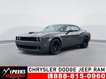 2023 Dodge Challenger R/T Scat Pack Widebody in a Destroyer Gray exterior color and Ruby Red/Blackinterior. McPeek's Chrysler Dodge Jeep Ram of Anaheim 888-861-6929 mcpeeksdodgeanaheim.com 