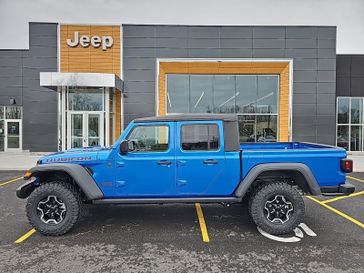 2023 Jeep Gladiator Rubicon 4x4 in a Hydro Blue Pearl Coat exterior color and Blackinterior. Victor Chrysler Dodge Jeep Ram 585-236-4391 victorcdjr.com 