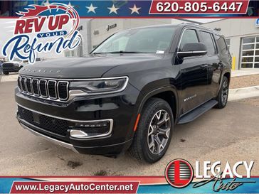 2023 Wagoneer Series III in a Diamond Black Crystal Pearl Coat exterior color and Blackinterior. Legacy Auto Center 620-315-9264 legacyautocenter.net 