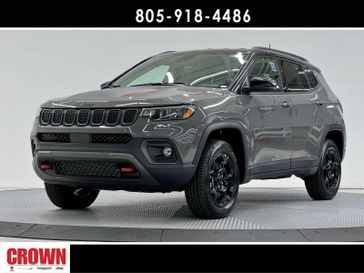 2024 Jeep Compass  in a Sting-Gray Clear Coat exterior color and Ruby Red/Blackinterior. Ventura Auto Center 866-978-2178 venturaautocenter.com 