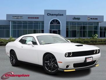 2023 Dodge Challenger Gt in a White Knuckle exterior color and HOUNDSTOOTHinterior. Champion Chrysler Jeep Dodge Ram 800-549-1084 pixelmotiondemo.com 