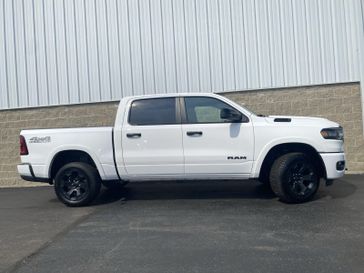 2025 RAM 1500 Big Horn Crew Cab 4x4 5'7' Box in a Bright White Clear Coat exterior color and Blackinterior. Wilmington Auto Center Chrysler Dodge Jeep Ram (937) 556-6430 wilmingtonautocentercdjr.com 