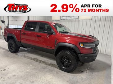 New 2026 RAM 1500 Rho Crew Cab 4x4 5'7' Box in a Molten Red Pearl Coat exterior color and Blackinterior. Thys Motor Company 319-318-6640 thysmotorco.com 
