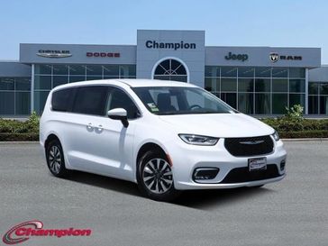 2023 Chrysler Pacifica Plug-in Hybrid Touring L in a Bright White Clear Coat exterior color and CAPRICE LTHRinterior. Champion Chrysler Jeep Dodge Ram 800-549-1084 pixelmotiondemo.com 