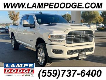 2024 RAM 2500 Laramie in a BRIGHT WHITE CLEAR Coat exterior color and Blackinterior. Lampe Chrysler Dodge Jeep RAM 559-471-3085 pixelmotiondemo.com 