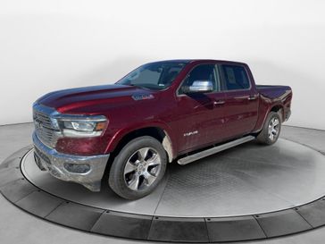 Used 2022 RAM 1500 Laramie in a Delmonico Red Pearl Coat exterior color and Blackinterior. Perkins La Junta 719-383-2250 perkinslajunta.com 