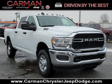 2024 RAM 2500 Tradesman Crew Cab 4x4 6'4' Box in a Bright White Clear Coat exterior color and Blackinterior. Carman Chrysler Jeep Dodge Ram 302-317-2378 carmanchryslerjeepdodge.com 