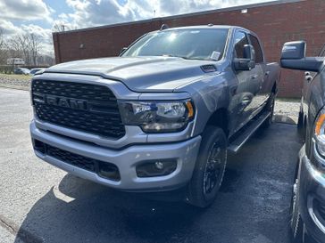 2024 RAM 2500 Big Horn Crew Cab 4x4 6'4' Box in a Billet Silver Metallic Clear Coat exterior color and Blackinterior. CDJR of Anytown 949-555-4321 pixelmotiondemo.com 