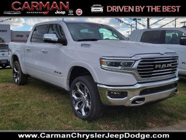 2024 RAM 1500 Limited Longhorn Crew Cab 4x4 5'7' Box in a Ivory White Tri Coat Pearl Coat exterior color and Mountain Brown - JYN8interior. Carman Chrysler Jeep Dodge Ram 302-317-2378 carmanchryslerjeepdodge.com 