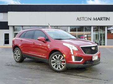 2023 Cadillac XT5 Sport in a Radiant Red Tint Coat exterior color and Cirrusinterior. Aston Martin of Glenview 847-904-1233 astonmartinofglenview.com 
