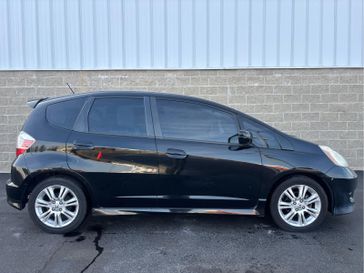 2009 Honda Fit Sport w/Navi in a Crystal Black Pearl exterior color and Blackinterior. Wilmington Auto Center Chrysler Dodge Jeep Ram (937) 556-4751 wilmingtonautocentercdjr.com 