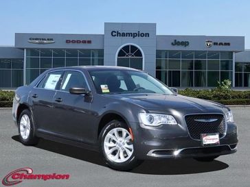 2023 Chrysler 300 Touring in a Granite Crystal Metallic exterior color and CLOTHinterior. Champion Chrysler Jeep Dodge Ram 800-549-1084 pixelmotiondemo.com 