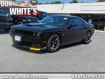 2023 Dodge Challenger R/T Scat Pack in a Pitch-Black exterior color and Blackinterior. Don White's Timonium Chrysler Dodge Jeep Ram 410-881-5409 donwhites.com 