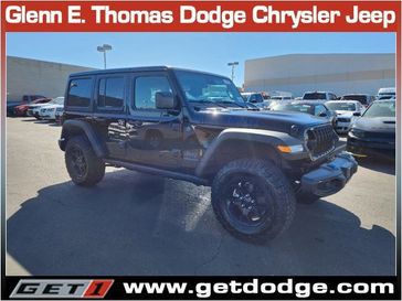 2024 Jeep Wrangler 4-door Willys 4xe in a Black Clear Coat exterior color and Blackinterior. Glenn E Thomas 100 Years Of Excellence (866) 340-5075 getdodge.com 