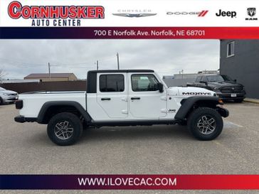 2024 Jeep Gladiator Mojave in a Bright White Clear Coat exterior color and A5X9interior. Cornhusker Auto Center 402-866-8665 cornhuskerautocenter.com 