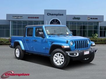 2023 Jeep Gladiator Sport S 4x4 in a Hydro Blue Pearl Coat exterior color and CLOTHinterior. Champion Chrysler Jeep Dodge Ram 800-549-1084 pixelmotiondemo.com 
