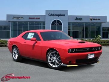2023 Dodge Challenger Gt in a TorRed exterior color and HOUNDSTOOTH CLOinterior. Champion Chrysler Jeep Dodge Ram 800-549-1084 pixelmotiondemo.com 