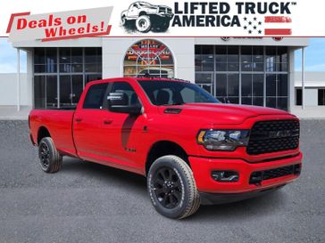 2024 RAM 3500 Big Horn in a Flame Red Clear Coat exterior color and Blackinterior. Lifted Truck America 888-267-0644 liftedtruckamerica.com 