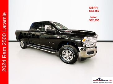 2024 RAM 2500 Laramie Crew Cab 4x4 6'4' Box in a Diamond Black Crystal Pearl Coat exterior color and Blackinterior. Sheridan Motors CDJR 307-218-2217 sheridanmotor.com 