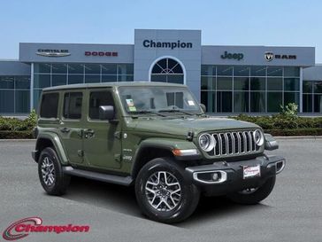 2024 Jeep Wrangler 4-door Sahara in a Sarge Green Clear Coat exterior color and CLOTHinterior. Champion Chrysler Jeep Dodge Ram 800-549-1084 pixelmotiondemo.com 