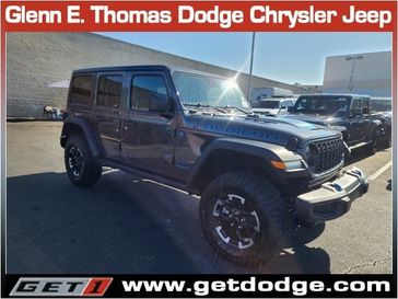 2024 Jeep Wrangler 4-door Rubicon 4xe in a Granite Crystal Metallic Clear Coat exterior color and Blackinterior. Glenn E Thomas 100 Years Of Excellence (866) 340-5075 getdodge.com 